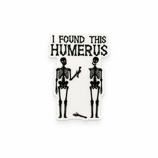 Funny skeleton “I Found This Humerus” plastic add-on with spooky anatomy design for compatible interchangeable badge reel bases