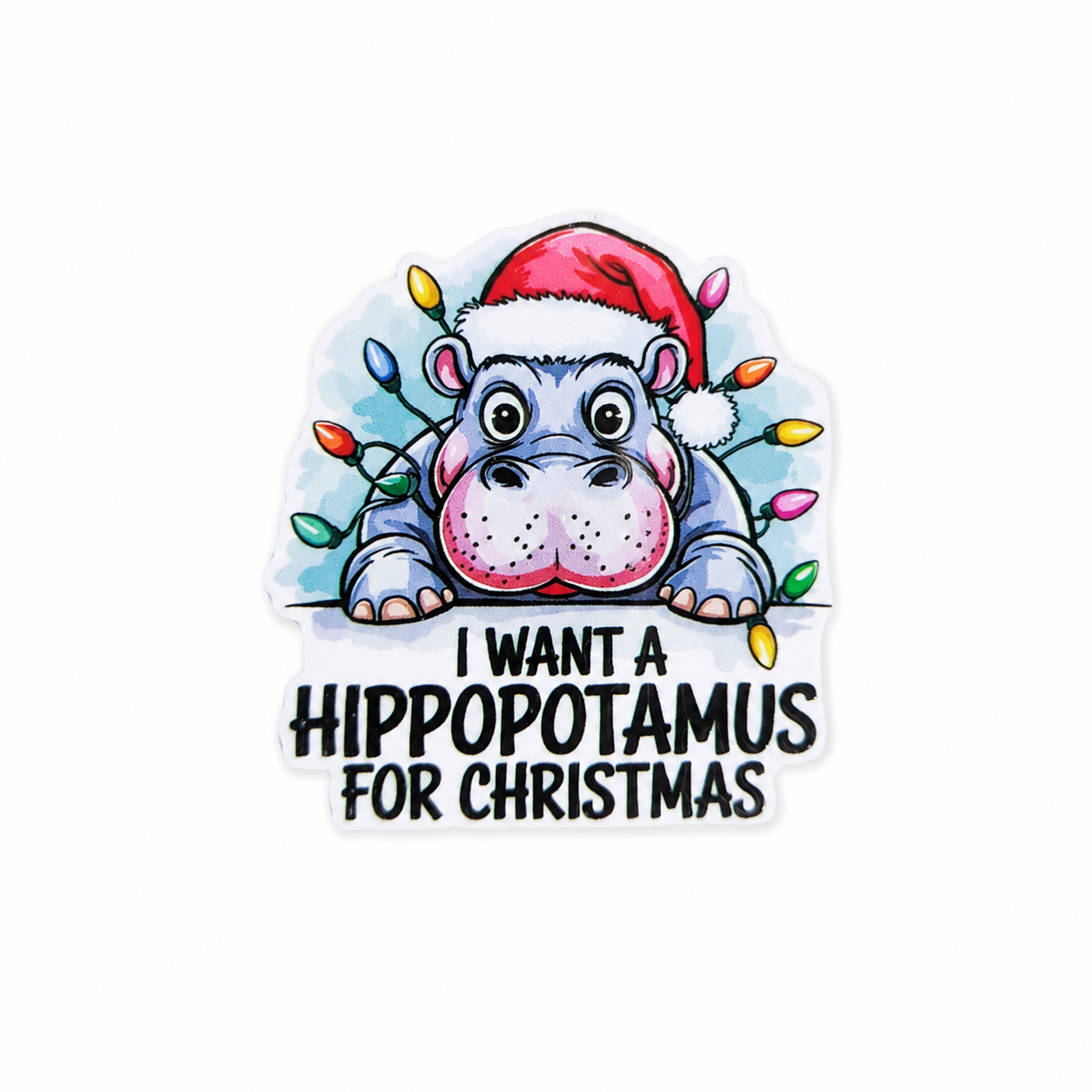 I WANT A HIPPOPOTAMUS FOR CHRISTMAS plastic add-on featuring a cute hippo wearing a Santa hat and Christmas lights, compatible with interchangeable badge reel bases.