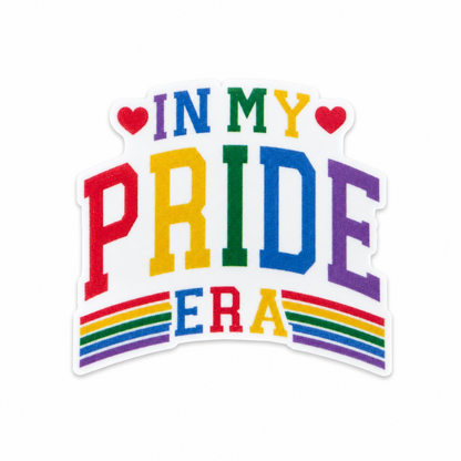 Plastic add-on featuring the text "IN MY PRIDE ERA" with rainbow colors and heart accents, compatible with interchangeable badge reel bases. LGBTQ+ pride accessory.