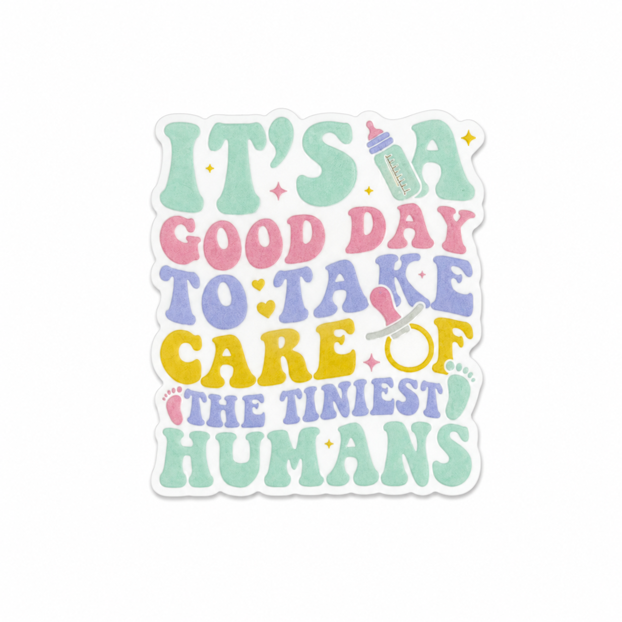 Plastic add-on featuring the phrase It's A Good Day To Take Care Of The Tiniest Humans with baby bottle, pacifier, and stethoscope design, compatible with interchangeable badge reel bases and ideal for pediatric and NICU nurses.