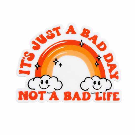 It's Just A Bad Day Not A Bad Life plastic add-on featuring a retro rainbow with smiling clouds, compatible with interchangeable badge reel bases.