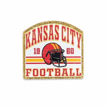 KANSAS CITY FOOTBALL plastic add-on featuring a vintage football helmet and gold glitter-inspired border, compatible with interchangeable badge reel bases and perfect for football fans.