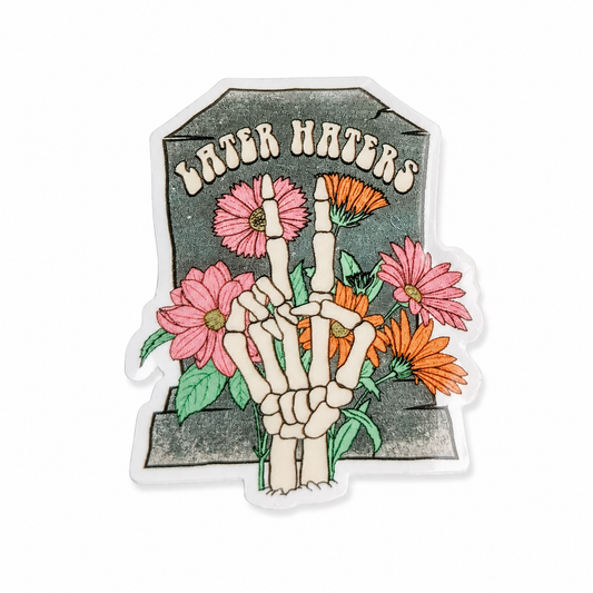 LATER HATERS plastic add-on with skeleton hand peace sign, pink and orange flowers, and tombstone background, compatible with interchangeable badge reel bases.