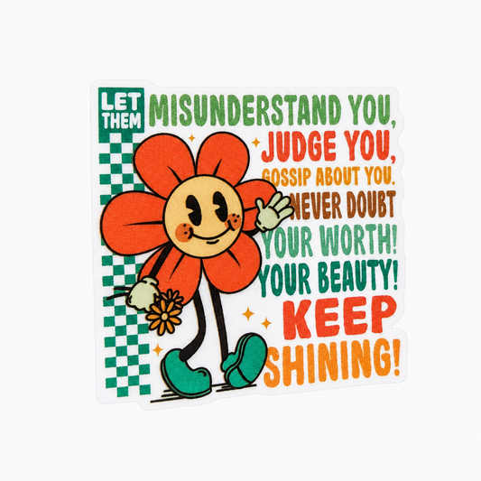 LET THEM MISUNDERSTAND YOU KEEP SHINING plastic add-on with colorful flower design, compatible with interchangeable badge reel bases.