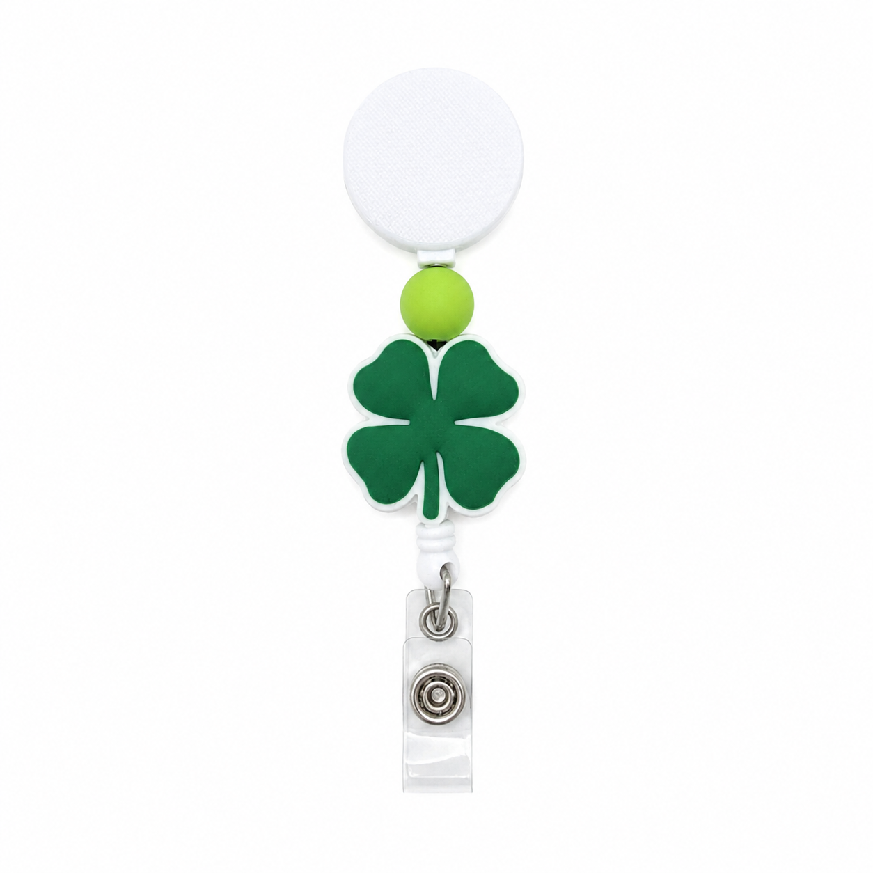 Lucky shamrock badge reel with a dark green four-leaf clover focal, lime-green accent bead, and white retractable badge reel for St. Patrick’s Day.