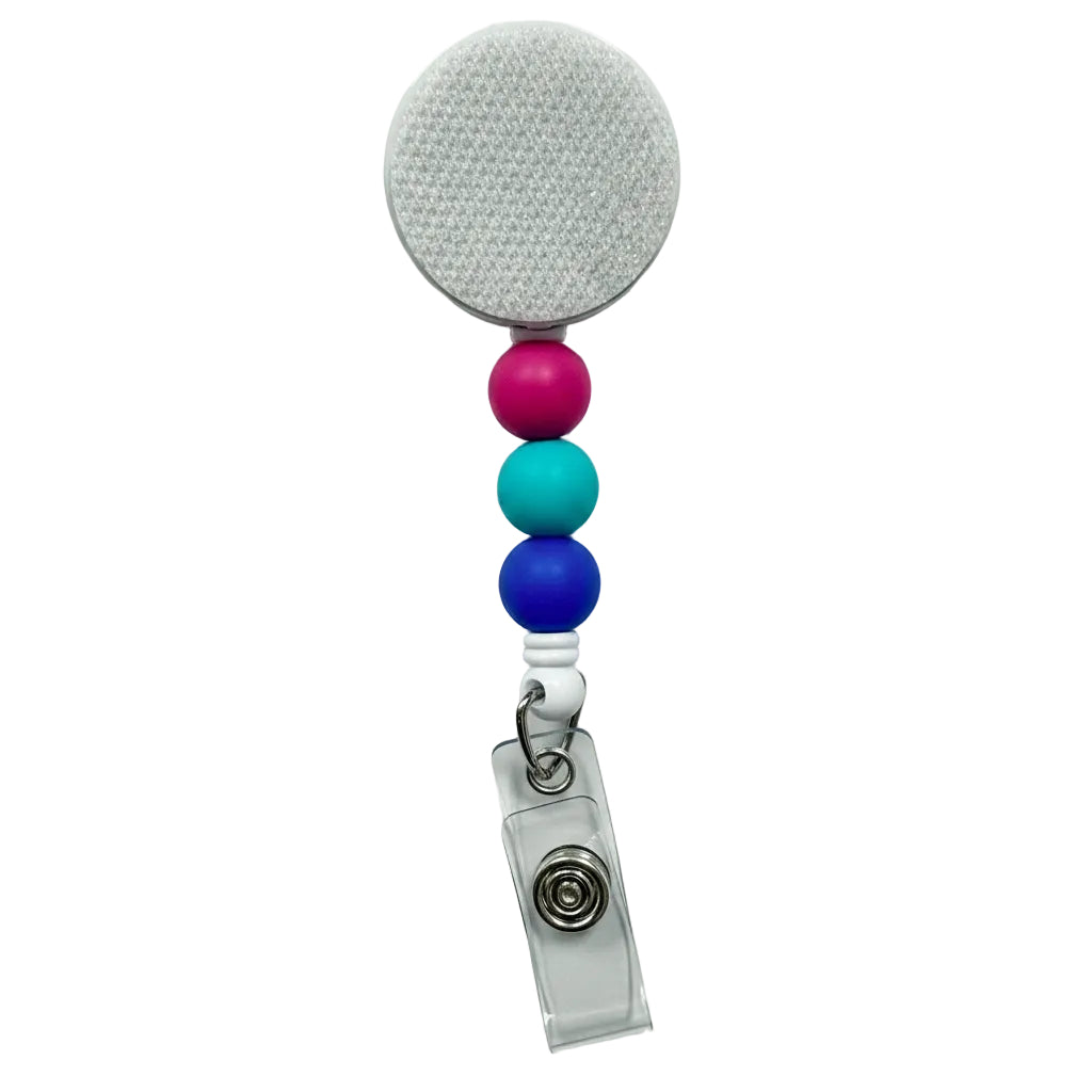 Mermaid Lagoon badge reel featuring pink, aqua, and deep blue silicone beads on a white retractable interchangeable badge reel for everyday work.