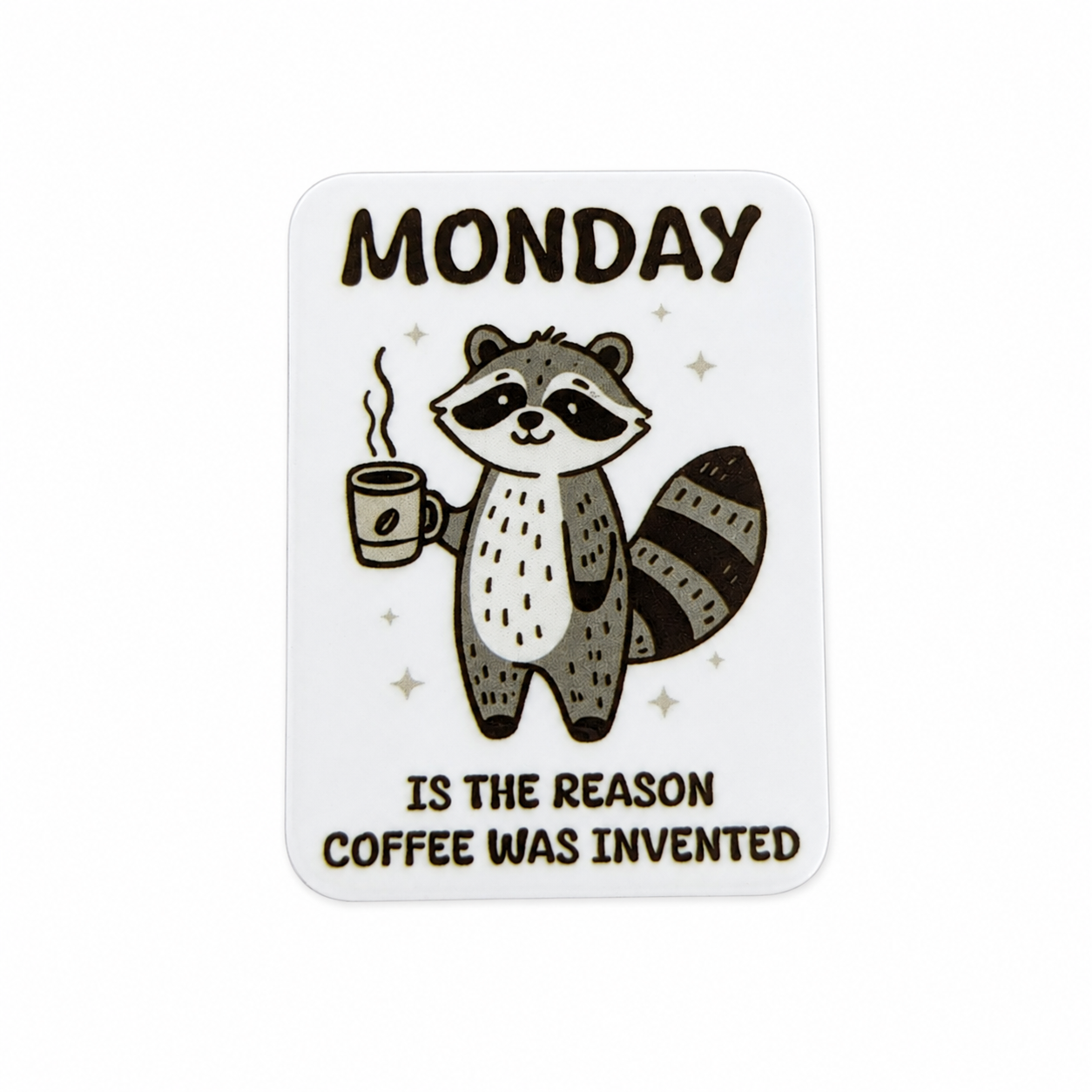 Plastic add-on featuring a raccoon holding a coffee cup with the phrase "MONDAY IS THE REASON COFFEE WAS INVENTED," compatible with interchangeable badge reel bases and perfect for coffee lovers.