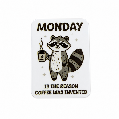 Plastic add-on featuring a raccoon holding a coffee cup with the phrase "MONDAY IS THE REASON COFFEE WAS INVENTED," compatible with interchangeable badge reel bases and perfect for coffee lovers.