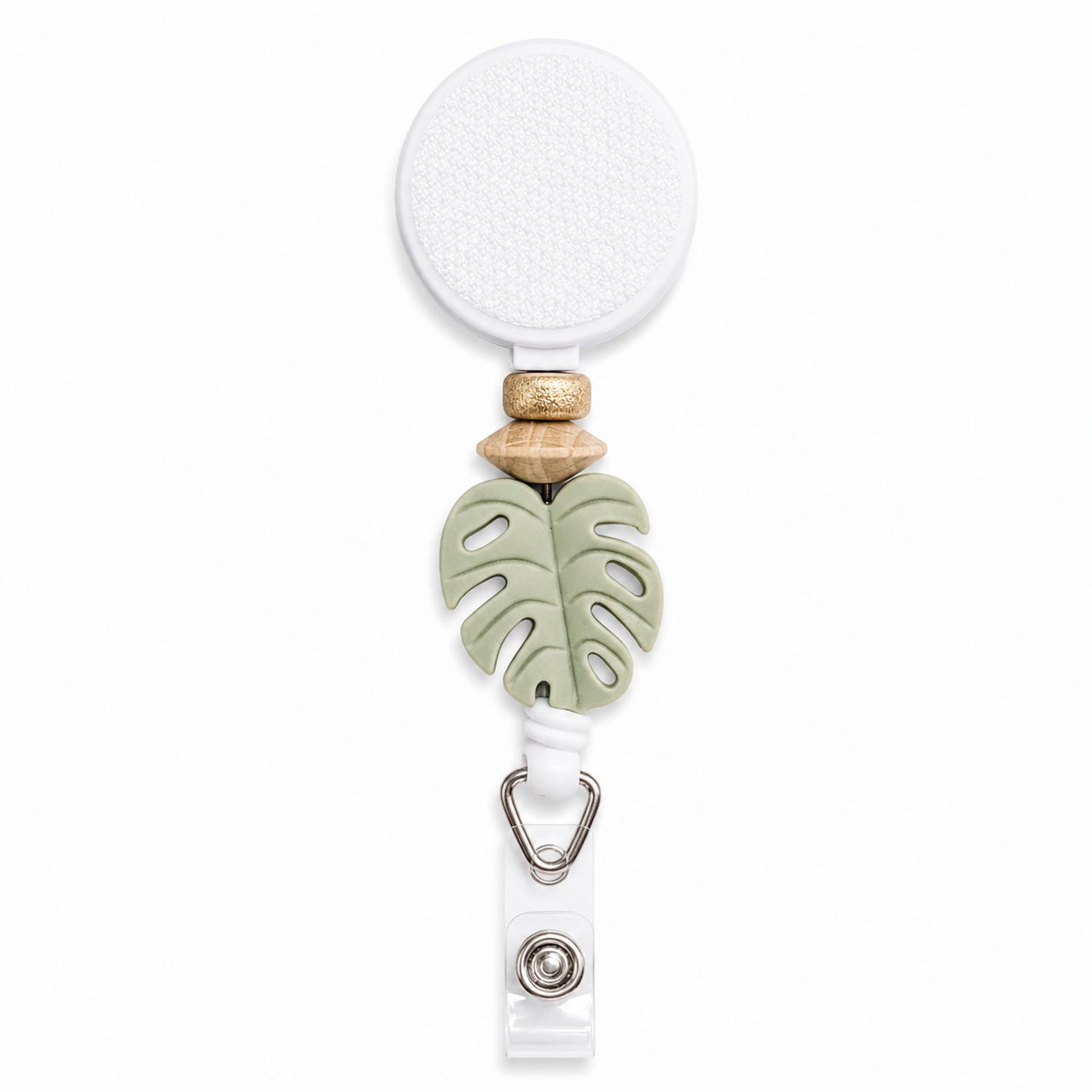 Monstera Grove interchangeable beaded badge reel featuring a sage green monstera leaf charm with natural wood beads and retractable badge holder.