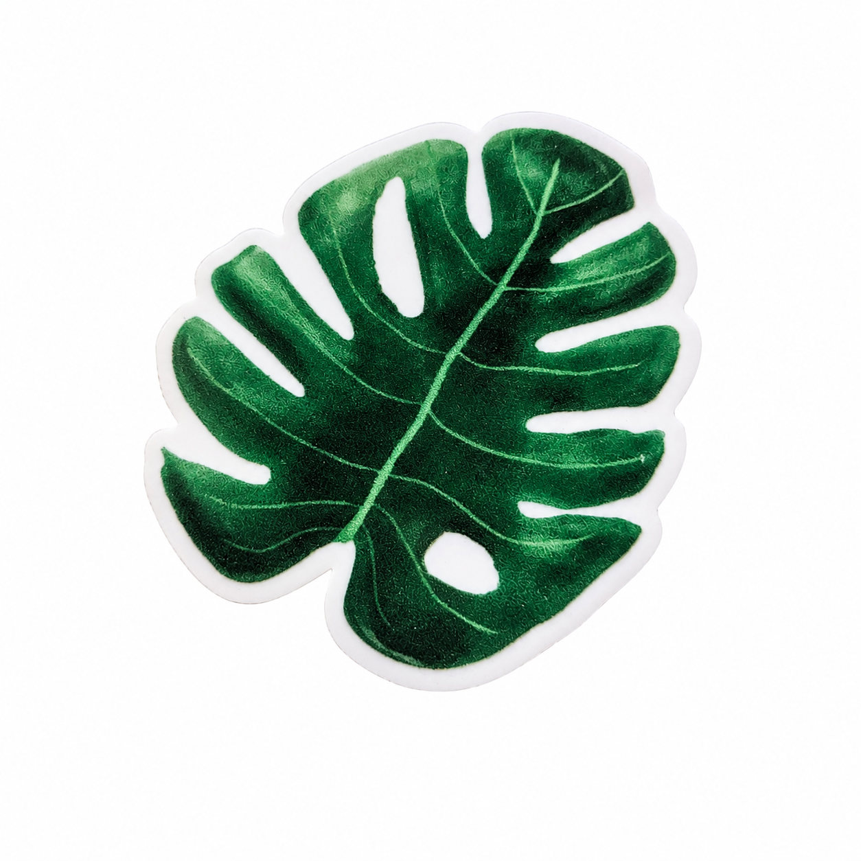 Monstera leaf plastic add-on with dark green tropical plant design, compatible with interchangeable badge reel bases.
