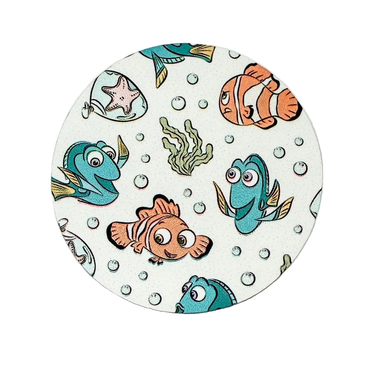 Nemo and Dory hard board add-on featuring colorful clownfish, blue tang fish, coral, bubbles, and seaweed, compatible with interchangeable badge reel bases.