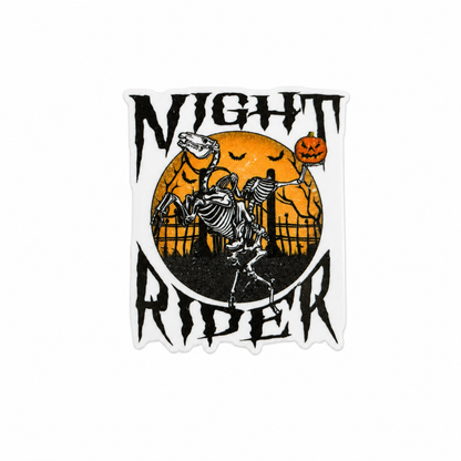 Night Rider plastic add-on featuring dancing skeletons, pumpkins, bats, moonlit graveyard scene, and Halloween artwork compatible with interchangeable badge reel bases.