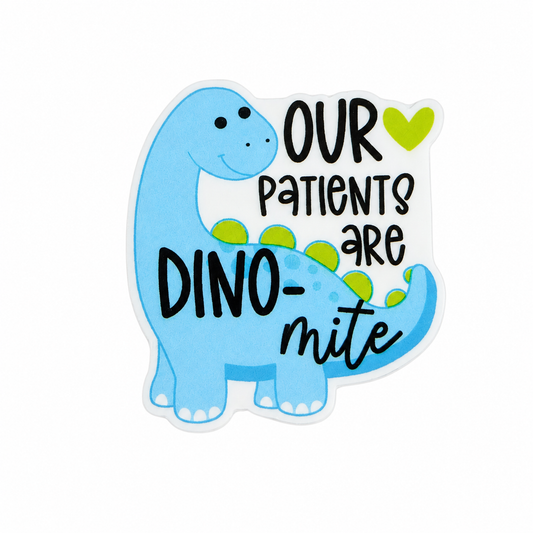Plastic add-on featuring a blue dinosaur and the phrase "OUR PATIENTS ARE DINO-mite," compatible with interchangeable badge reel bases and perfect for pediatric healthcare workers