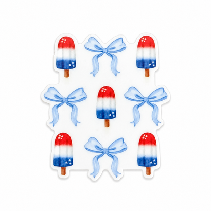 Plastic add-on featuring red, white, and blue popsicles with blue bows in a patriotic summer design, compatible with interchangeable badge reel bases.
