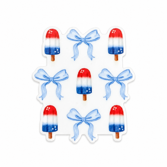 Plastic add-on featuring red, white, and blue popsicles with blue bows in a patriotic summer design, compatible with interchangeable badge reel bases.