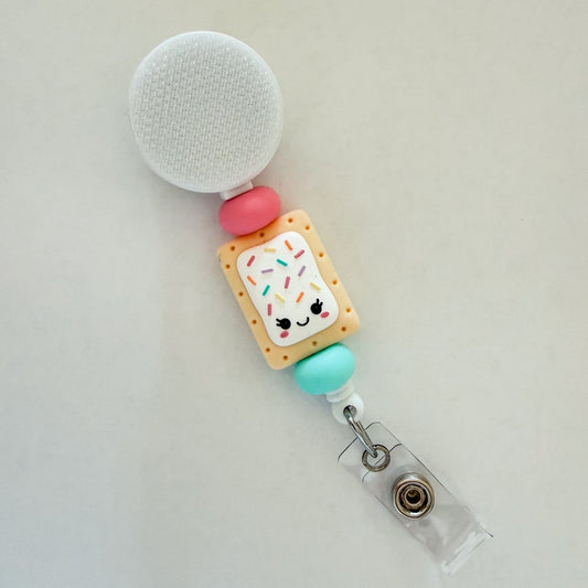 Pop Tart interchangeable badge reel with sprinkle pastry design for nurses and teachers