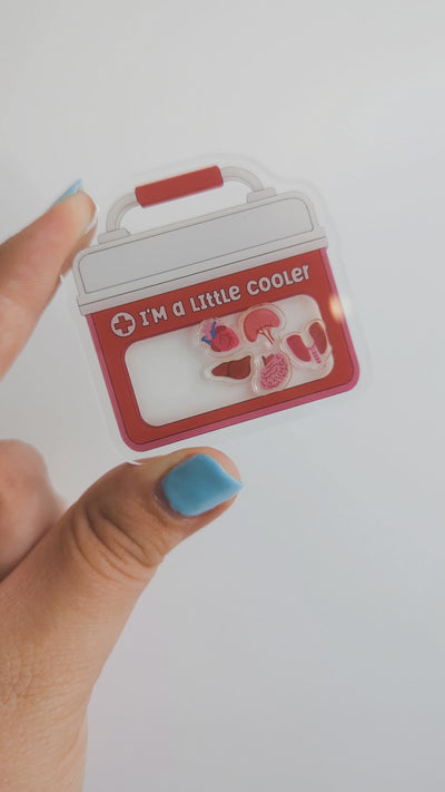 I'm A Little Cooler plastic shaker add-on featuring a pink medical cooler with anatomy organ shaker pieces for compatible interchangeable badge reel bases.