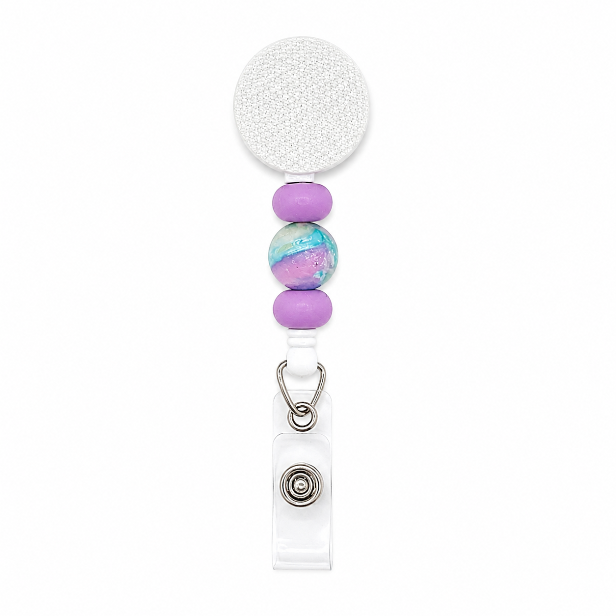 Pastel galaxy beaded badge reel featuring lavender silicone beads, a purple and blue marbled accent bead, and a white retractable badge reel for everyday work.