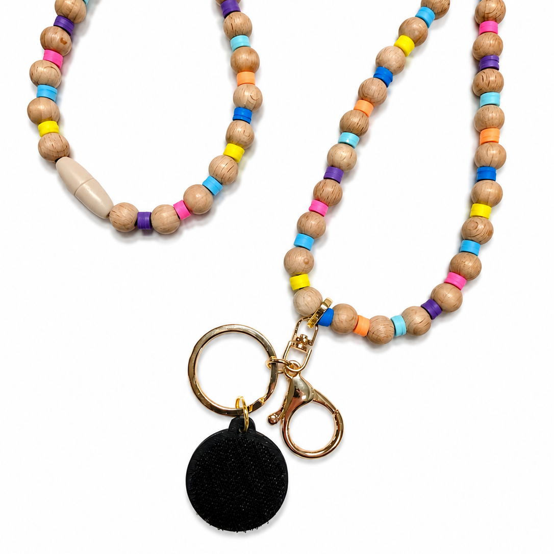 Rainbow interchangeable beaded lanyard with natural wood beads, colorful silicone accent beads, gold-tone hardware, and attached hook-and-loop disc, compatible with Badge Beauties interchangeable hardboards and plastic add-ons.