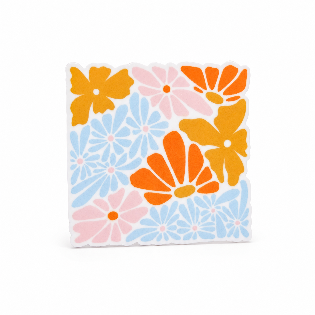 Retro floral plastic add-on with orange, mustard yellow, pale pink, and light blue flowers, compatible with interchangeable badge reel bases for flower lovers.