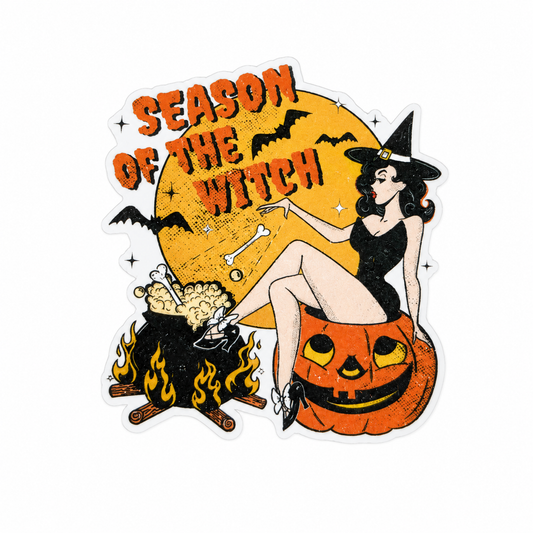 Season of the Witch plastic add-on featuring a witch sitting on a jack-o'-lantern with bats, moon, cauldron, and campfire, compatible with interchangeable badge reel bases.