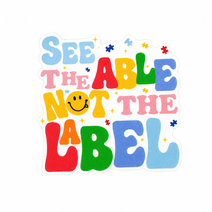 SEE THE ABLE NOT THE LABEL plastic add-on featuring colorful retro lettering, puzzle pieces, and smiley face, compatible with interchangeable badge reel bases and perfect for autism acceptance advocacy.