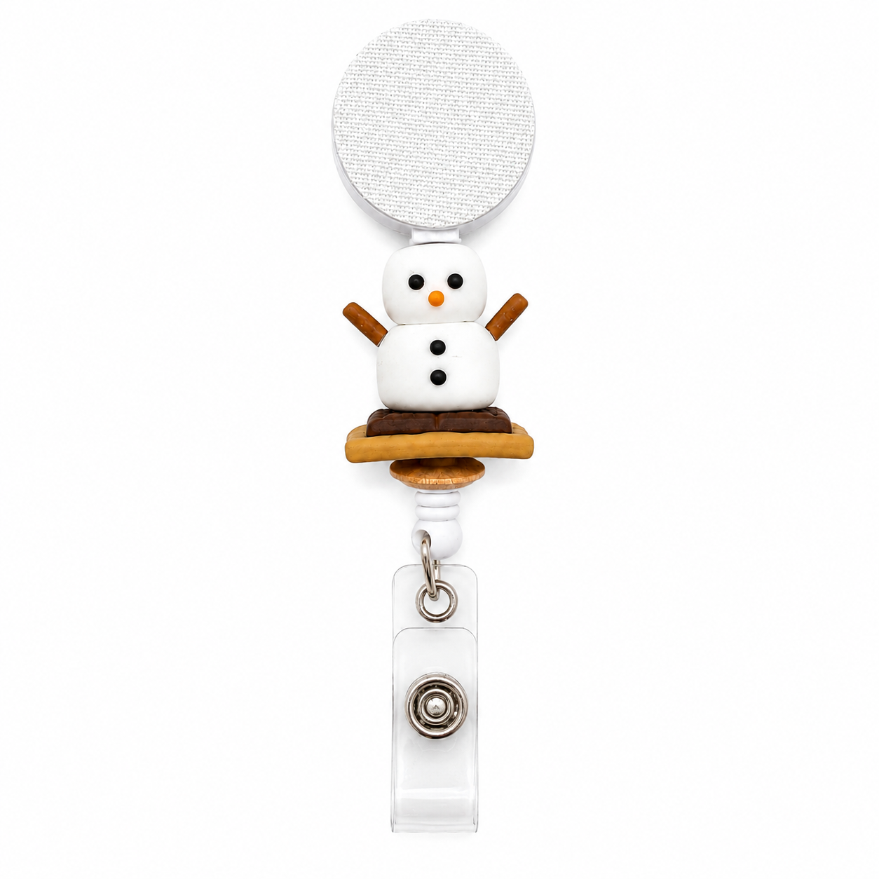 S'mores badge reel featuring a smiling marshmallow character sitting on a chocolate and graham cracker s'more with a retractable badge reel and secure badge holder attachment.