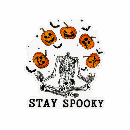 STAY SPOOKY plastic add-on with sitting skeleton, jack-o’-lantern pumpkins, bats, and stars, compatible with interchangeable badge reel bases.
