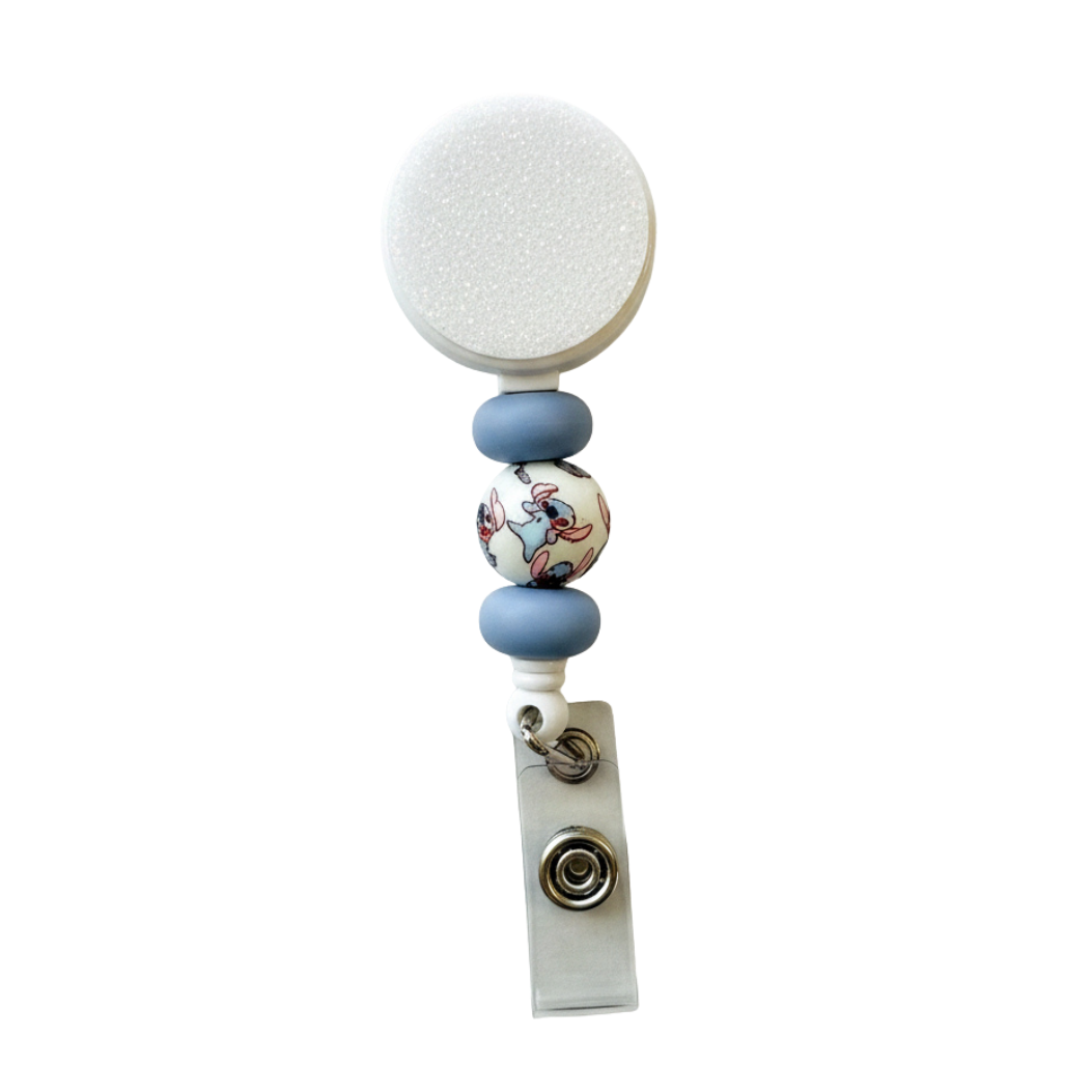 Stitch interchangeable badge reel featuring soft blue silicone beads and a cute blue alien printed focal bead on a retractable badge reel.