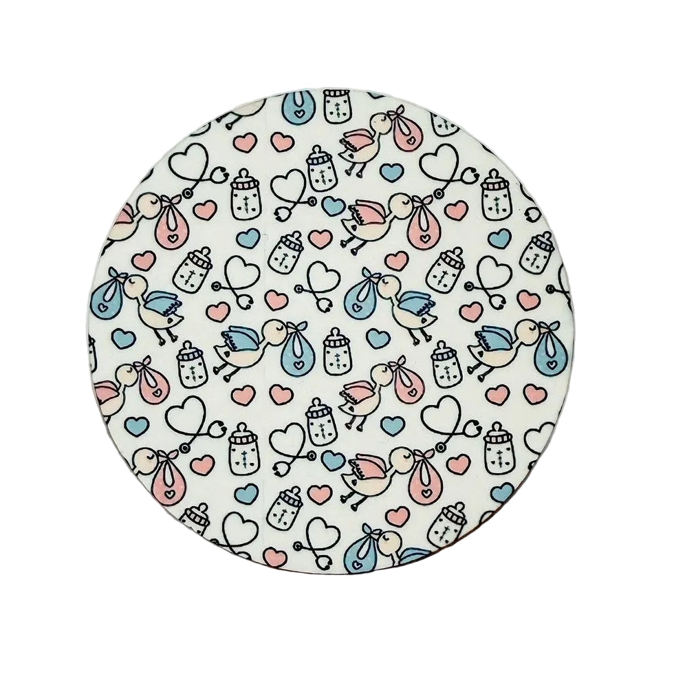 Stork Delivery hard board add-on featuring baby storks carrying newborn bundles, baby bottles, hearts, and pastel accents, compatible with interchangeable badge reel bases.