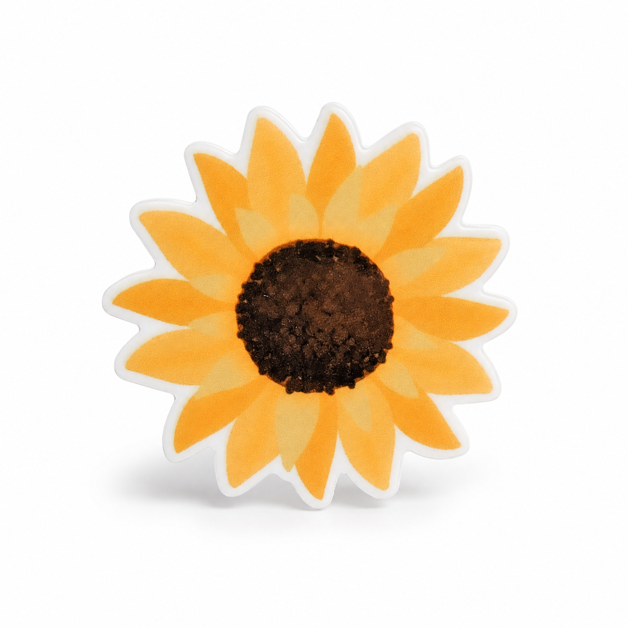 Sunflower plastic add-on with layered golden-yellow petals and a dark brown center, compatible with interchangeable badge reel bases for flower lovers.