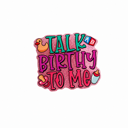 Talk Birthy To Me plastic add-on featuring baby-themed icons, toy blocks, baby bottle, duck, and glitter design compatible with interchangeable badge reel bases for NICU nurses