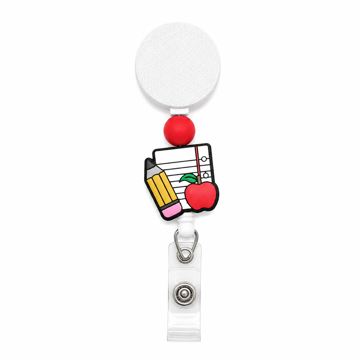 Teacher essentials interchangeable badge reel featuring a notebook, pencil, and apple design with a red silicone bead on a white retractable badge reel.