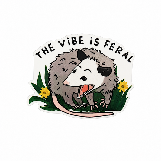 Plastic add-on featuring the text "THE VIBE IS FERAL" with a cute opossum and yellow flowers, compatible with interchangeable badge reel bases and ideal for opossum lovers.