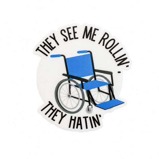 THEY SEE ME ROLLIN’ THEY HATIN’ plastic add-on with blue wheelchair design, compatible with interchangeable badge reel bases for funny wheelchair accessory style.