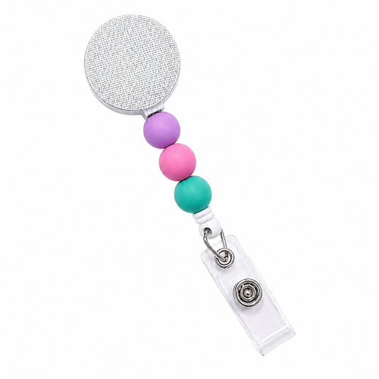 Tropical Taffy badge reel featuring aqua blue, periwinkle blue, and pearl white decorative beads with a retractable badge reel design and secure badge holder attachment.