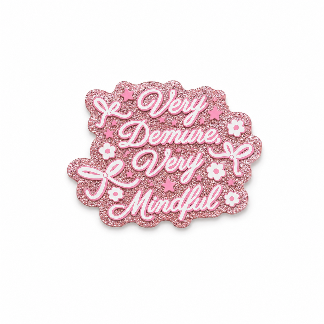 Very Demure Very Mindful plastic add-on featuring a pink glitter-inspired background, bows, and flowers, compatible with interchangeable badge reel bases and perfect for trendy feminine aesthetics.