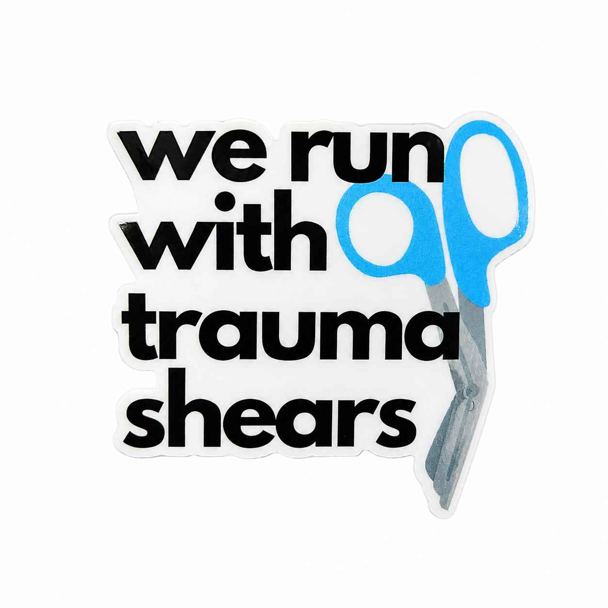 We Run With Trauma Shears plastic add-on with blue trauma shears design, compatible with interchangeable badge reel bases as an ER nurse accessory.
