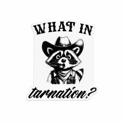 Plastic add-on featuring a surprised raccoon dressed as a cowboy with the phrase "What In Tarnation?" compatible with interchangeable badge reel bases and perfect for western humor lovers.