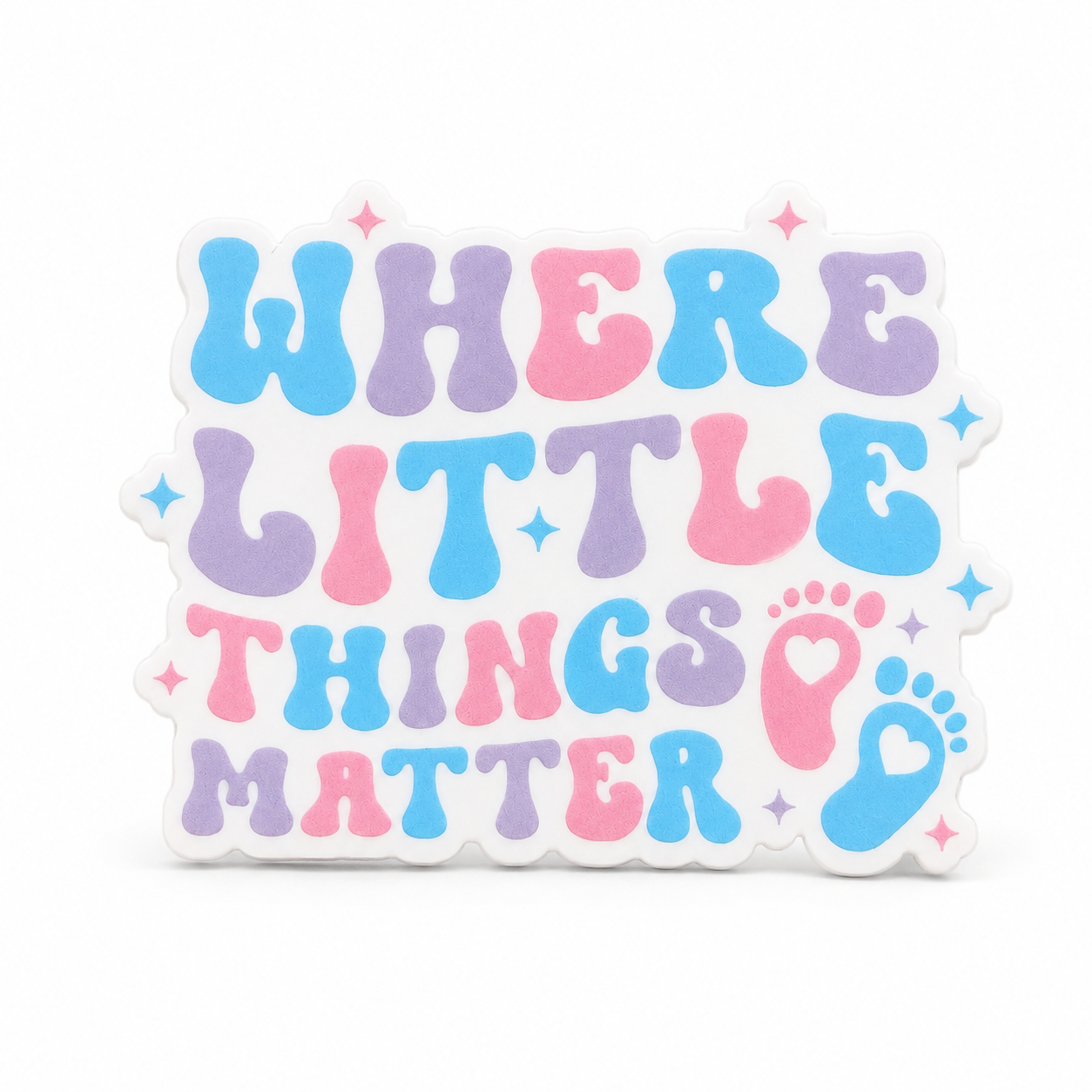 Where Little Things Matter plastic add-on featuring pastel lettering and baby footprints, compatible with interchangeable badge reel bases, perfect for NICU nurses and labor and delivery healthcare workers