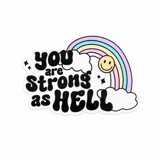 You are strong as Hell plastic add-on with pastel rainbow, clouds, and smiley face, compatible with interchangeable badge reel bases.