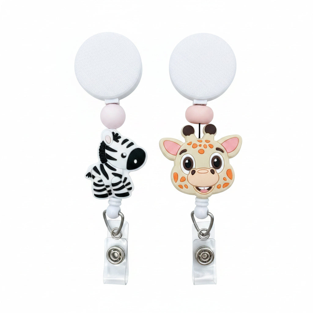 Safari animal badge reel available in cute zebra and giraffe designs with soft pink bead accents, retractable badge reel for nurses, teachers, pediatric staff, and animal lovers.